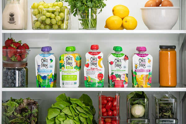 fridge filled with once upon a farm pouches and fresh produce