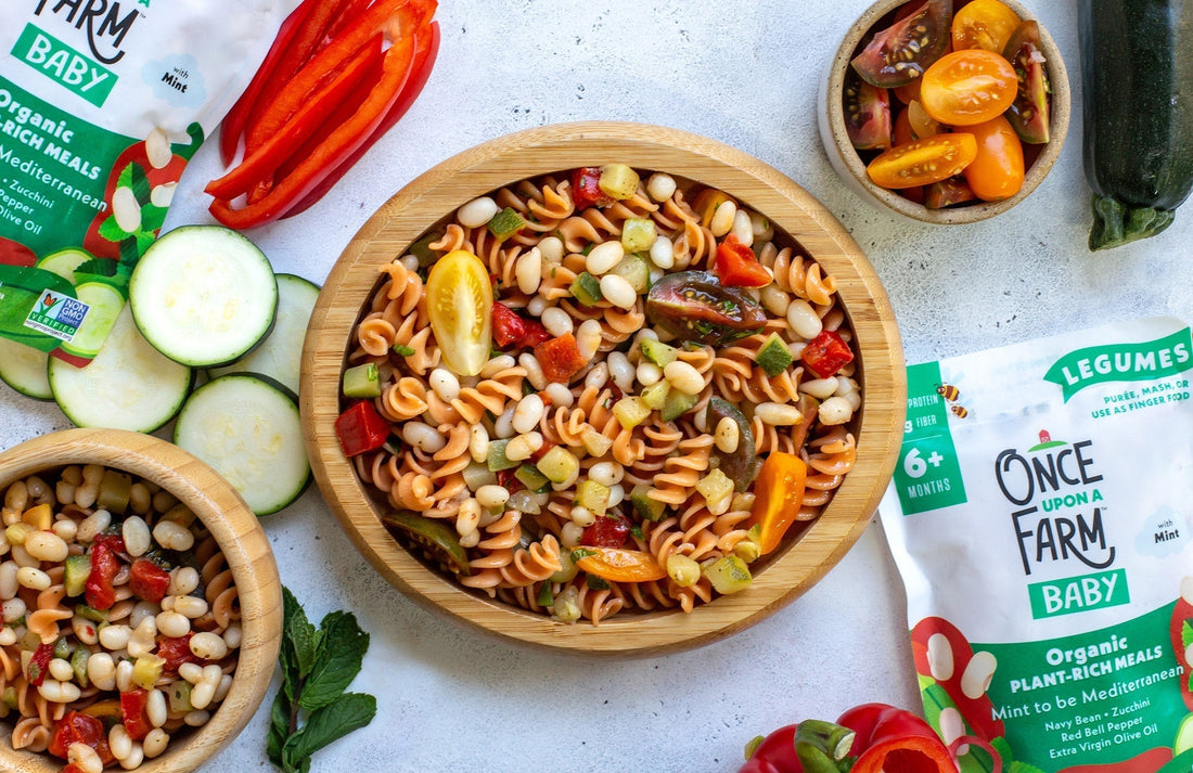 Mediterranean pasta salad on a wooden plate