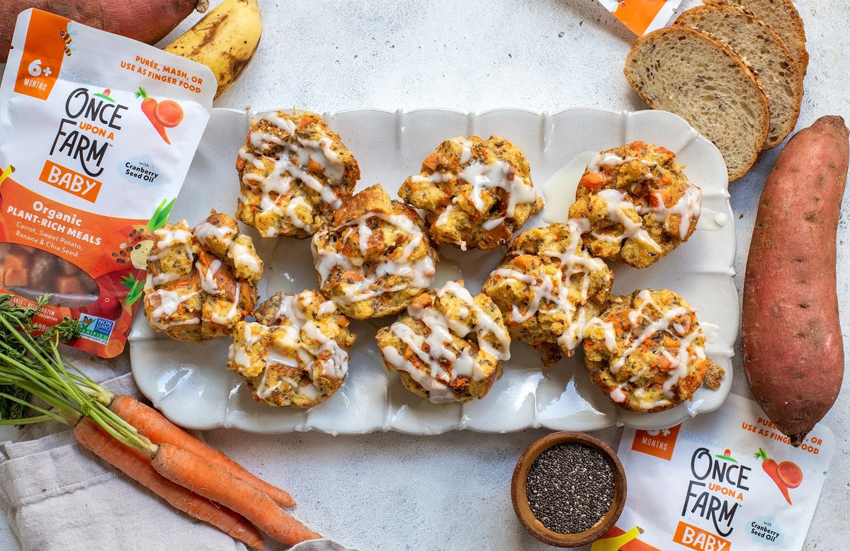carrot cake French toast cups on a serving plate, surrounded by fresh ingredients