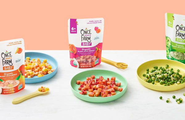 3 Once Upon a Farm frozen Plant-Rich Meal packages, next to plates of each of them prepared