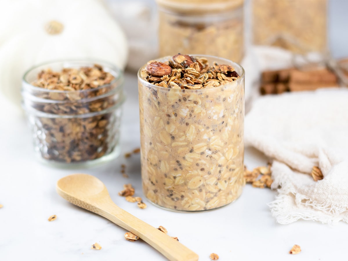 pumpkin overnight oats in a jar, next to a jar of granola