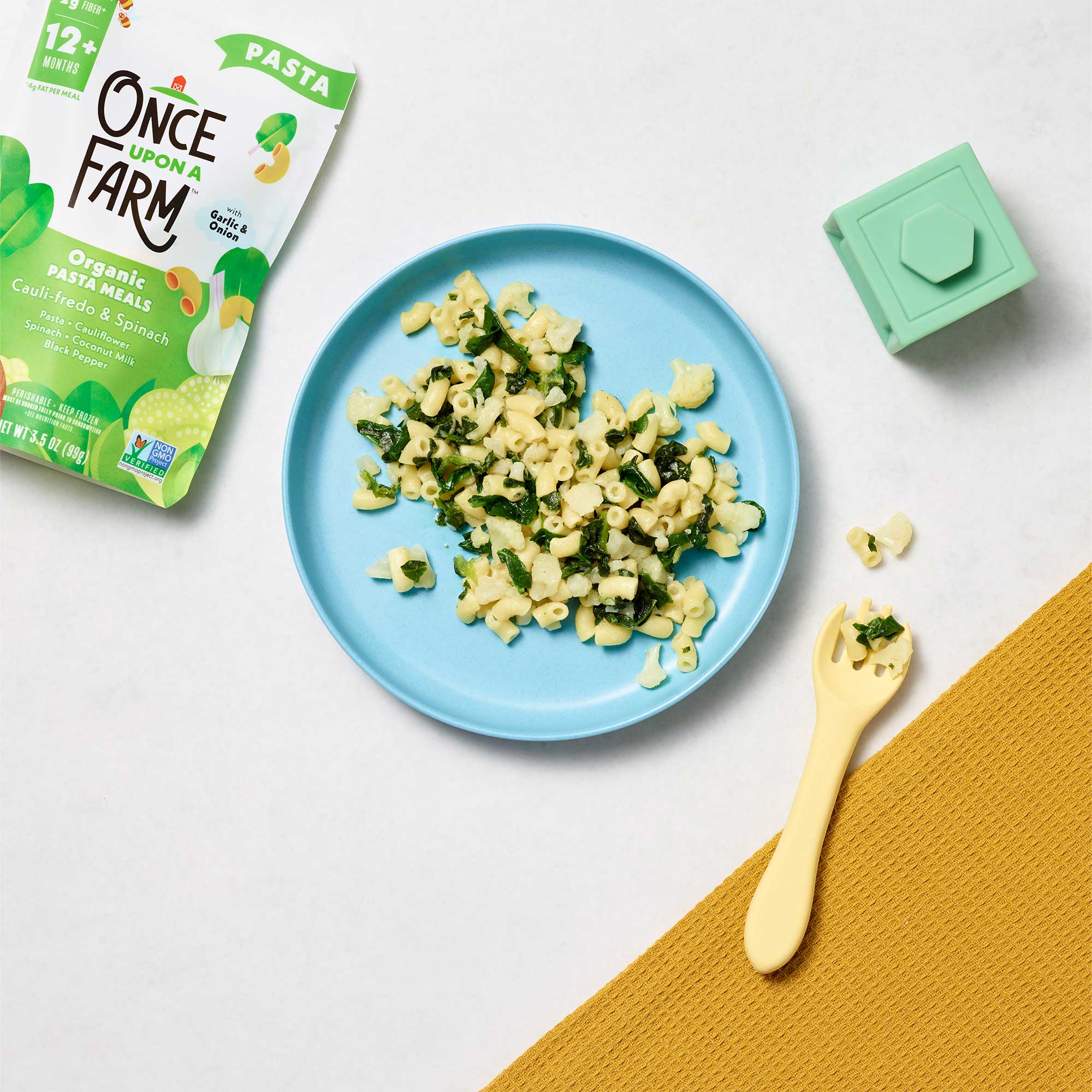 Organic Pasta Meals Cauli-fredo & Spinach Plated on a table
